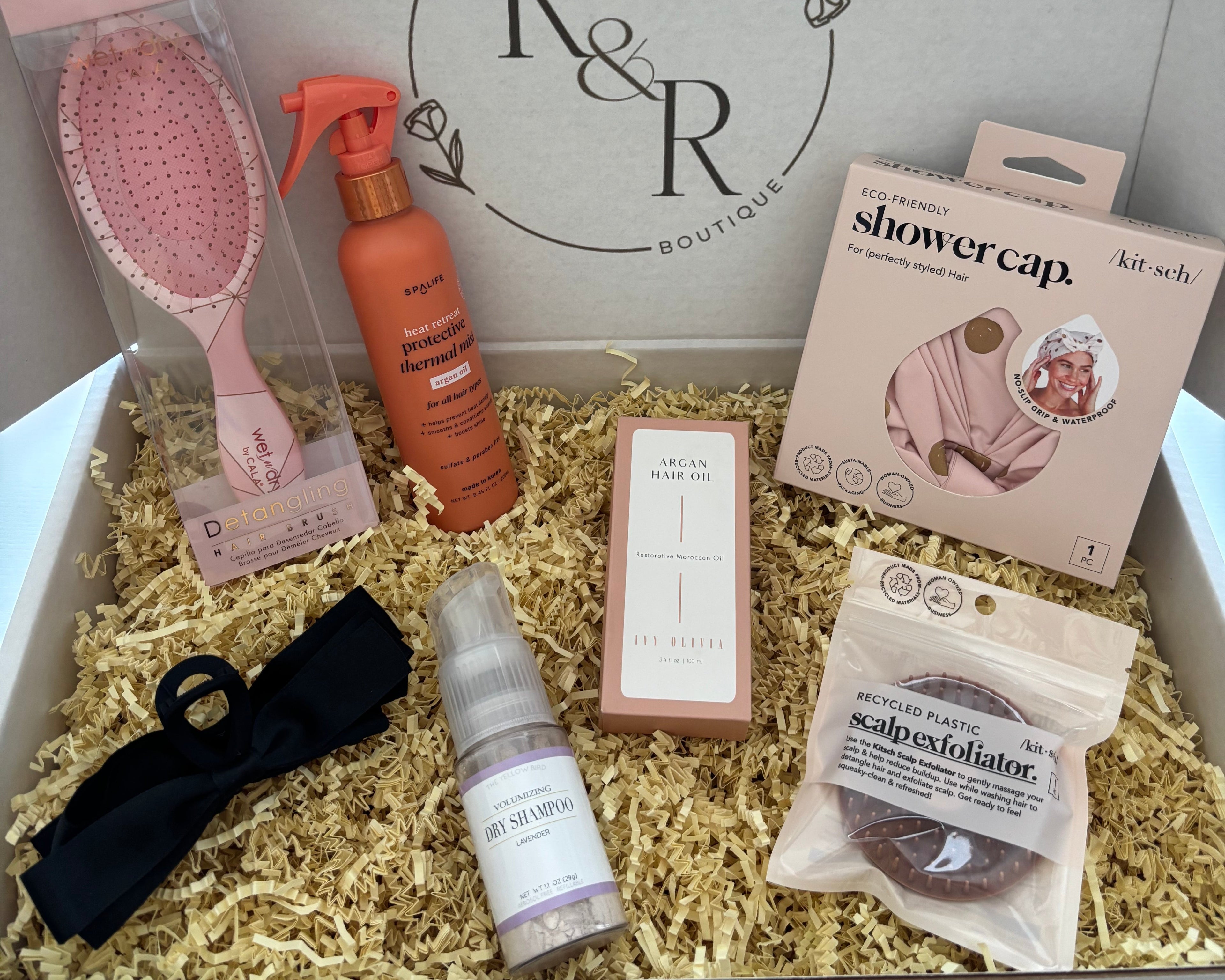 selfcare gift box for hair care and grooming including shower cap, hair brush, hair clip, scalp exfoliator, dry shampoo, Moroccan Argan Hair Oil, protective thermal hair mist