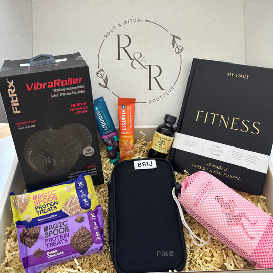 Gift box for fitness and recovery including Daily Fitness Journal for workout tracking and meal planning, pure arnica oil, Brij adjustable wearable weights, Anna Kaci woven resistance bands set, vibrating foam roller, Liquid I.V. drink mixes, Magic Spoon Protein bars, personal training session
