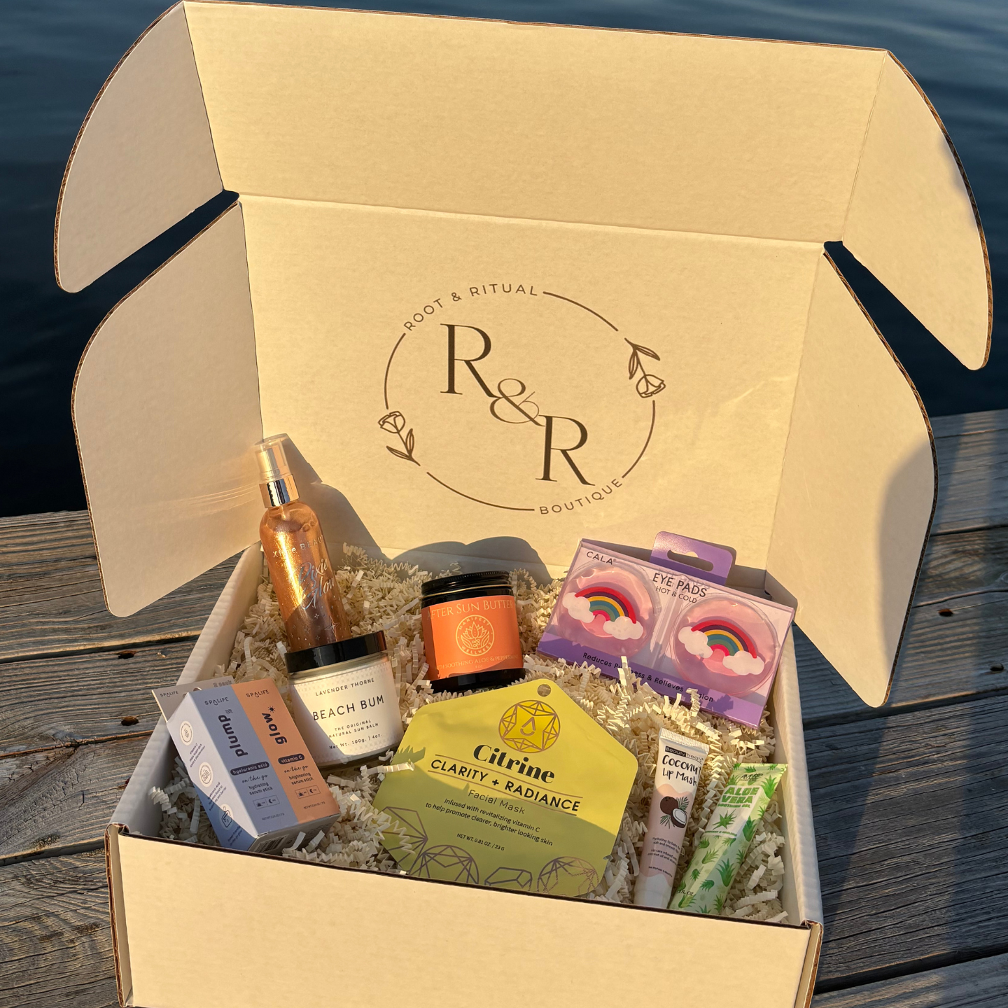 summer self care box featuring Korean skincare, face mask, face serum, lip mask, aloe vera, sunscreen, after sun lotion, shimmer spray, and cooling eye pads